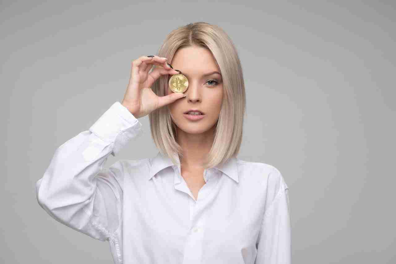 Woman showing cryptocurrency Woman showing cryptocurrency