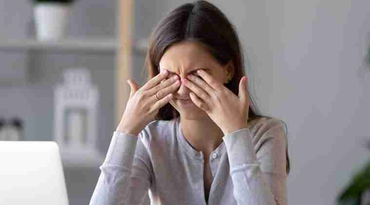 Girl rubbing eyes